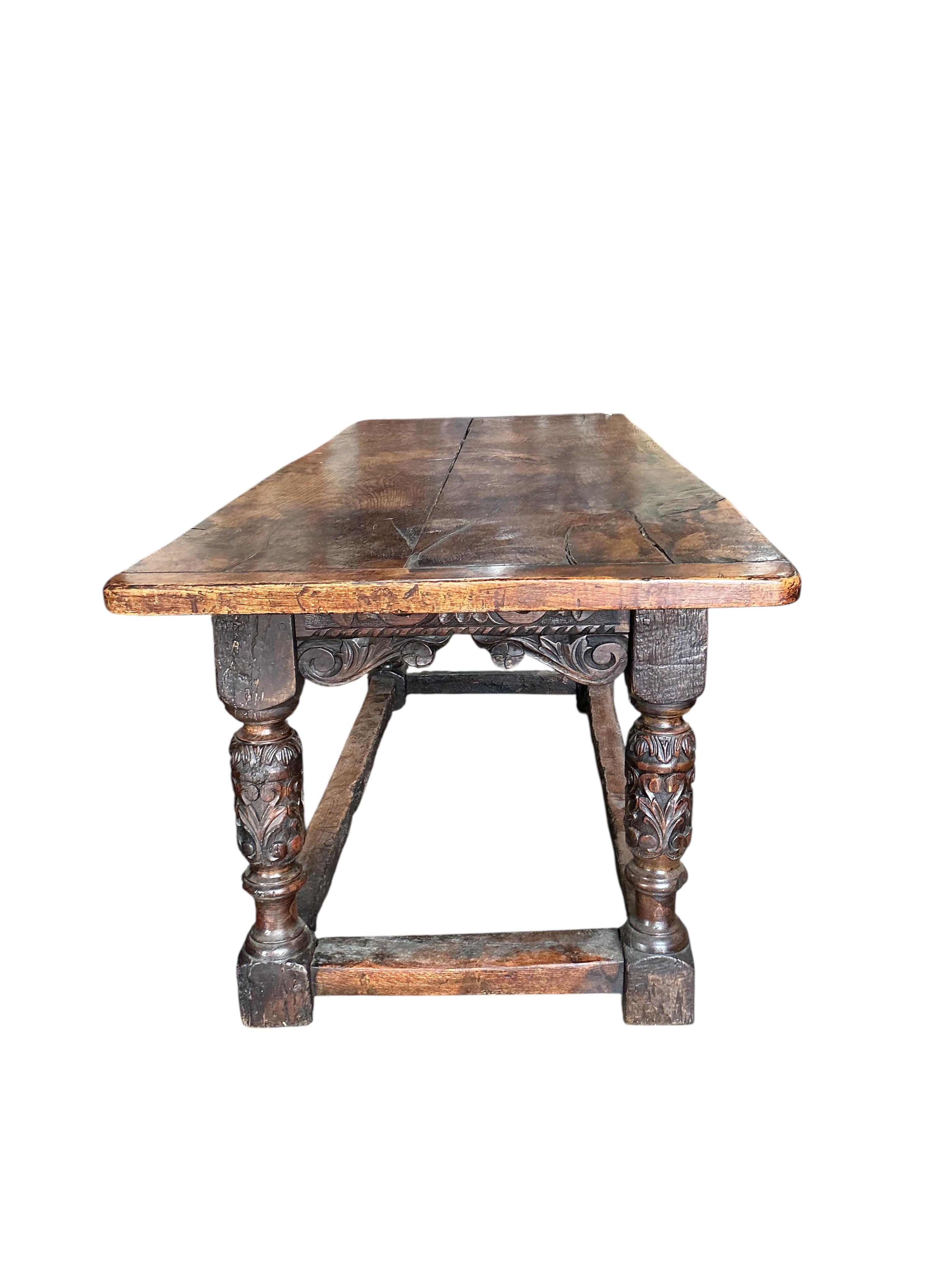 A 17th century style carved oak rectangular refectory table, incorporates old timber, width 198cm, depth 75cm, height 76cm